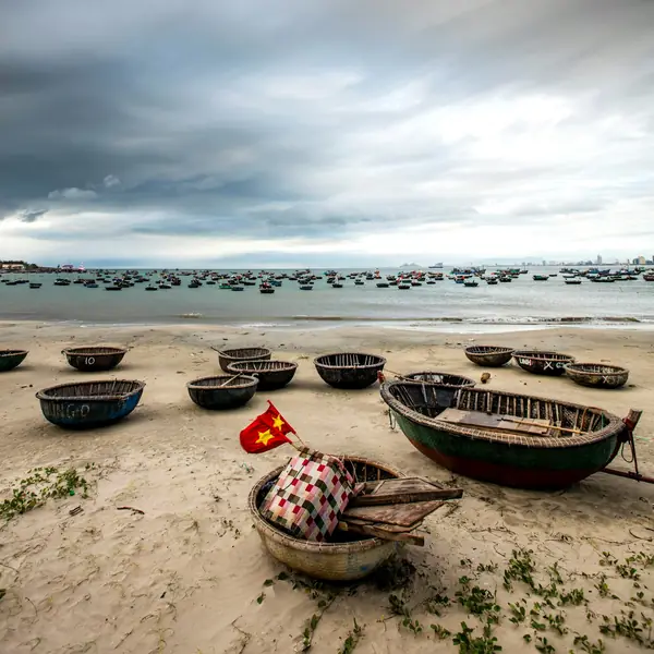 Round basket boats pulled up on the sand of a Da Nang beach